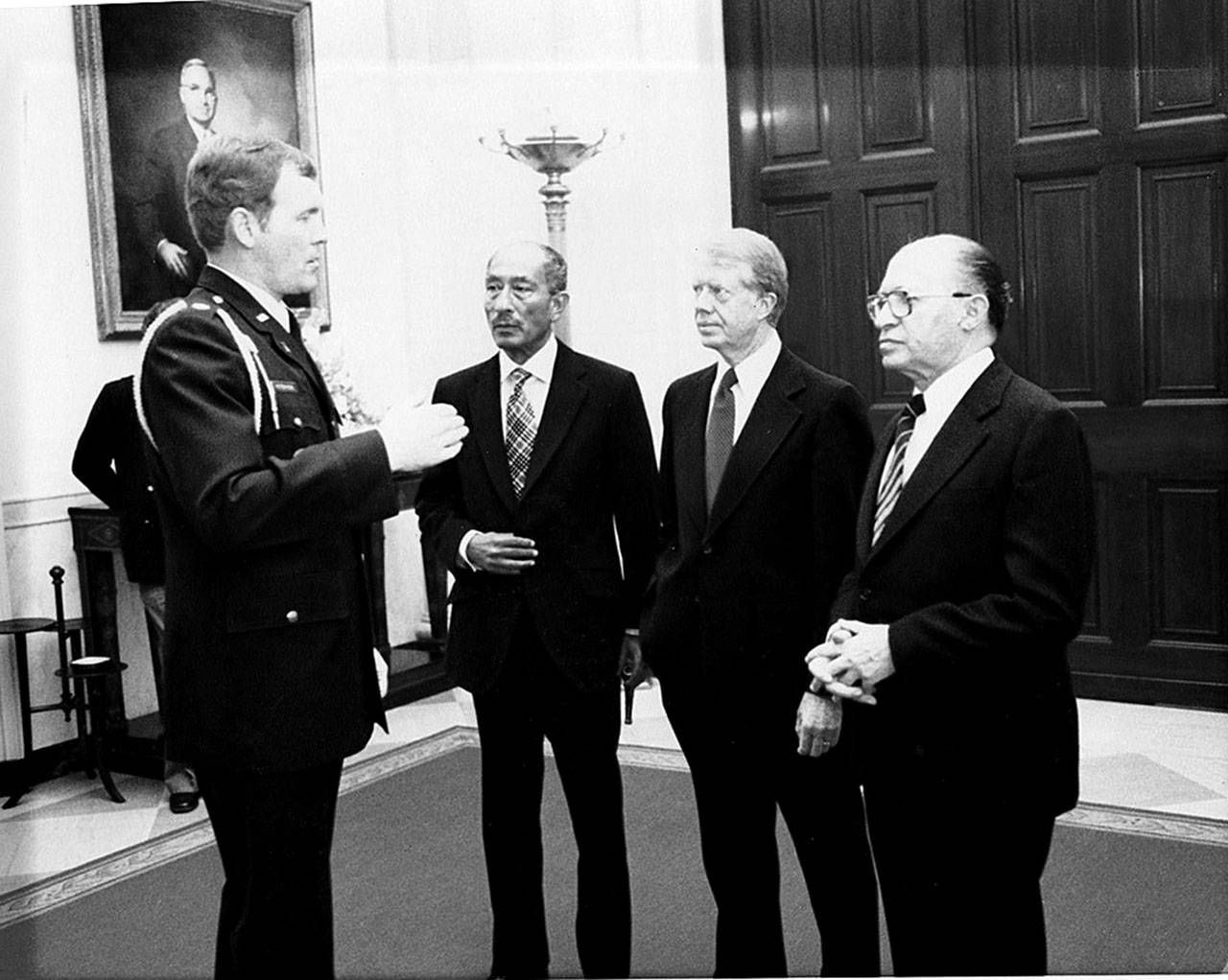 Port Angeles High School graduate Bob Peterson, left, meets with Egypt’s Anwar Sadat, U.S. President Jimmy Carter and Isreal’s Menachem Begin in the 1970s. After starring as a Roughriders football player, Peterson joined the U.S. Air Force and will be inducted into the Roughrider Hall of Fame on Saturday.