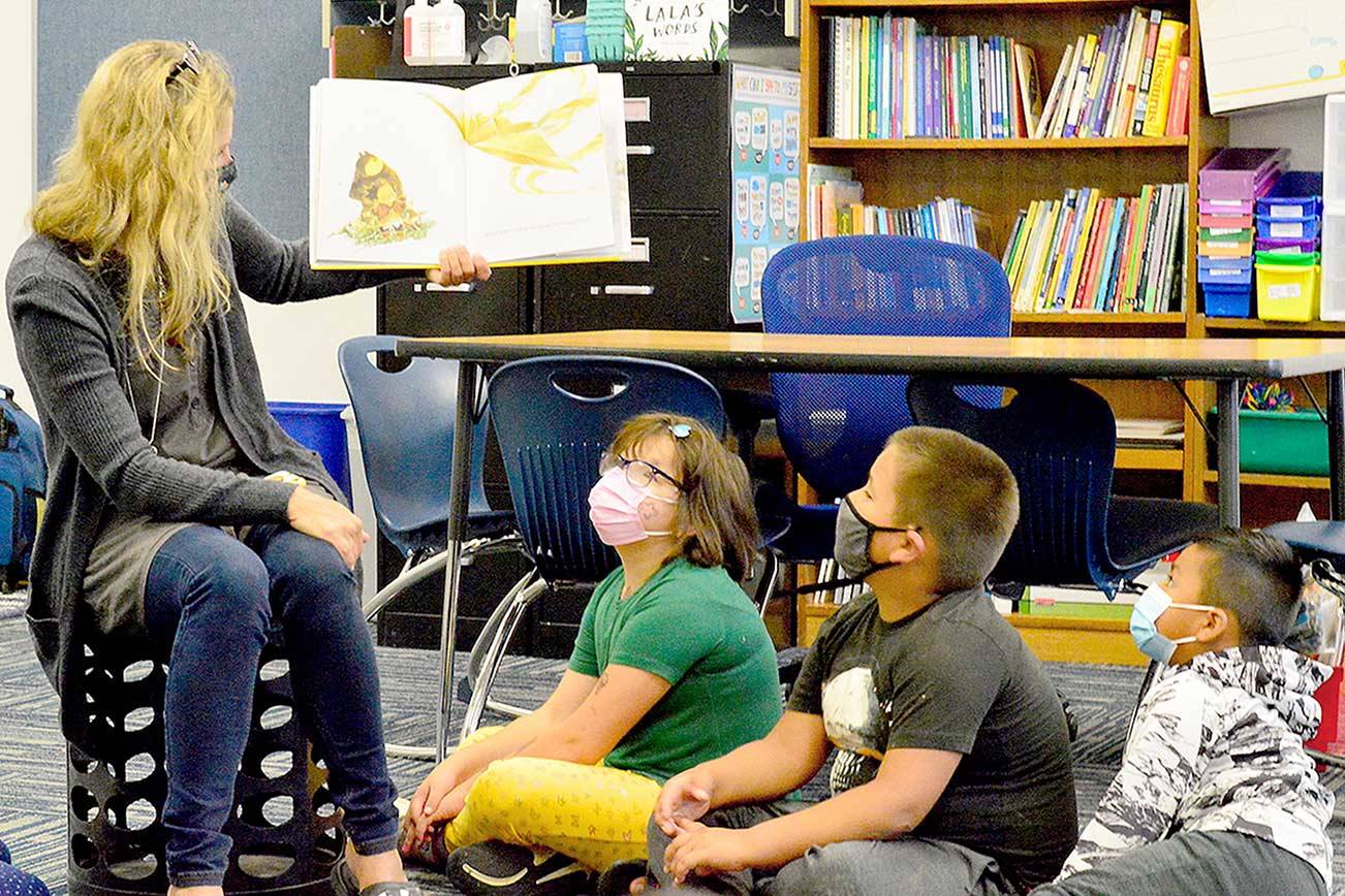 Chimacum Elementary summer school teacher Michelle Moseley reads “What Do You Do with a Chance?” to her students Tuesday morning. (Diane Urbani de la Paz/Peninsula Daily News)
