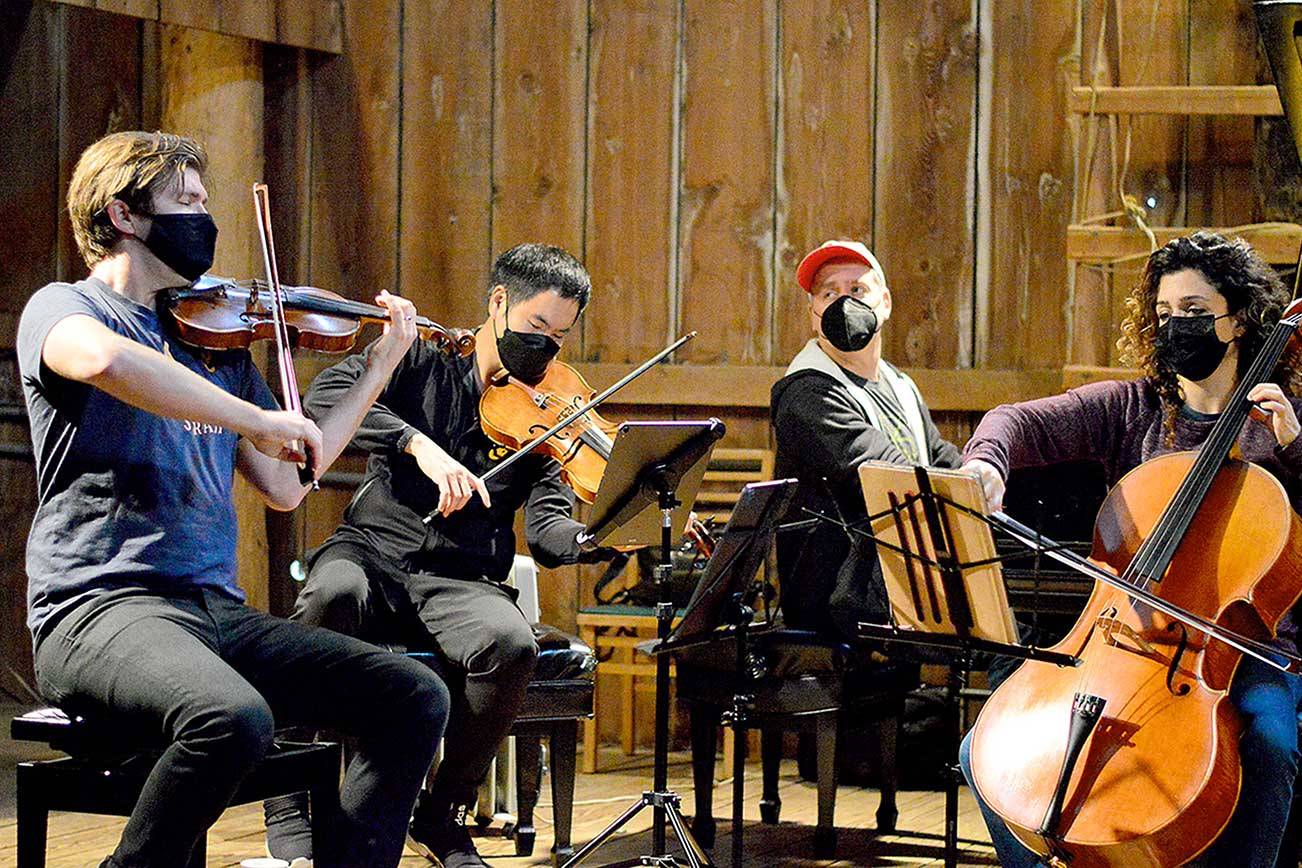 The barn at Trillium Woods Farm near Quilcene is the setting for free chamber concerts this summer, including last Sunday’s performance by, from left, James Garlick, Richard O’Neill, Jeremy Denk and Ani Aznavoorian. This weekend will bring the final Concerts in the Barn at 2 p.m. Saturday and Sunday. Patrons who sit inside the barn must show proof of vaccination. (Diane Urbani de la Paz/Peninsula Daily News)