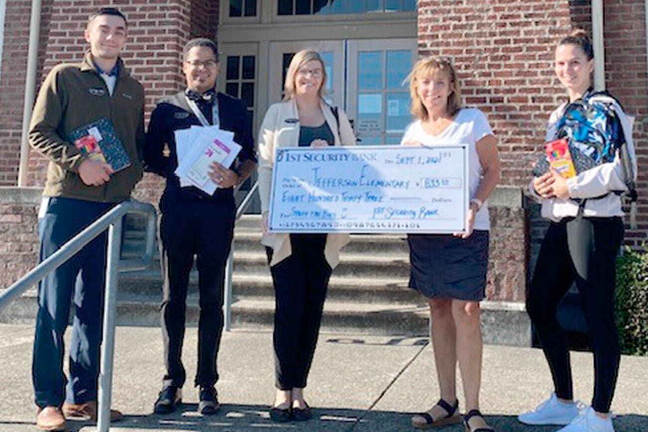 The Port Angeles Branch of 1st Security Bank make a cash donation to Jefferson Elementary School from its Stuff the Bus campaign. 

Pictured, from left to right, are John James, Tyrone Beatty, Erica Rudesill, Rhonda Kromm and Britney Martin. 

The bank has hosted the annual fundraiser for more than ten years; this year’s campaign raised more than $41,000 state-wide in cash and essential supplies, like backpacks and notebooks, for local schools.