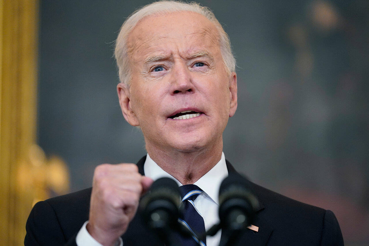 President Joe Biden speaks in the State Dining Room at the White House, Thursday in Washington. Biden is announcing sweeping new federal vaccine requirements affecting as many as 100 million Americans in an all-out effort to increase COVID-19 vaccinations and curb the surging delta variant. (AP Photo/Andrew Harnik)