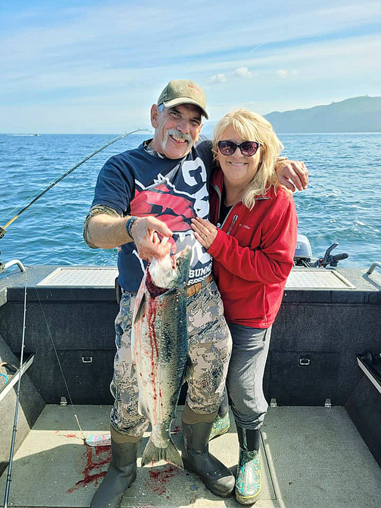 Terry and Barbara Rossow of Ellensburg caught this good-sized coho while fishing off Sekiu on Wednes-day. The pair also enjoyed whale watching after the big catch.