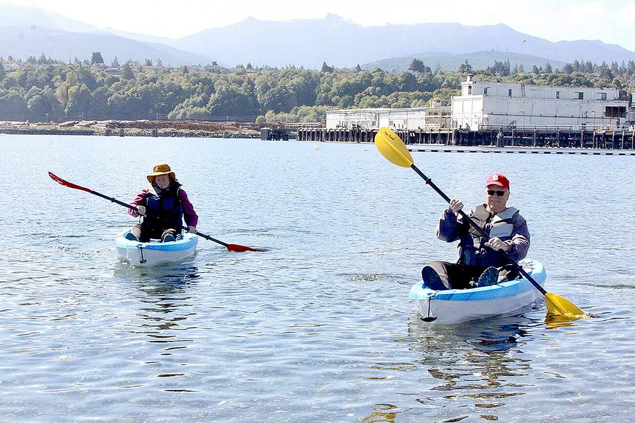 Dave Logan/For Peninsula Daily News 
Sue and Tom Lotz of Port Angeles take what they call a “coffee break” in their small kayaks near Sail and Paddle Park on Ediz Hook on Thursday. They were enjoying the last days of nice weather before a predicted rain storm expected this weekend. The Lotzes said they were greeted by at least a dozen seals in the harbor on their leisurely excursion.