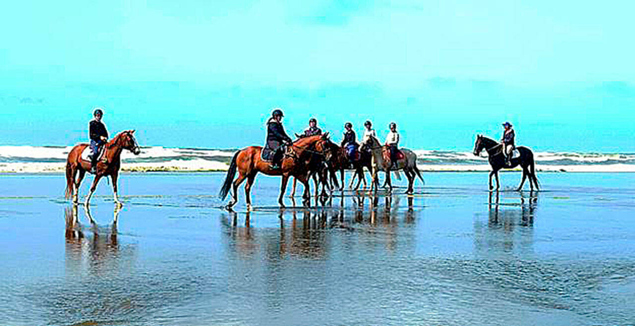 In August Freedom Farm’s trainer Mary Gallagher, far right, took her Advanced Hoof Beats students to camp and ride along the shore on the west side of the Olympic Peninsula in Long Beach. All came home with wonderful lifetime memories. (Photo by Kimi Robertson)