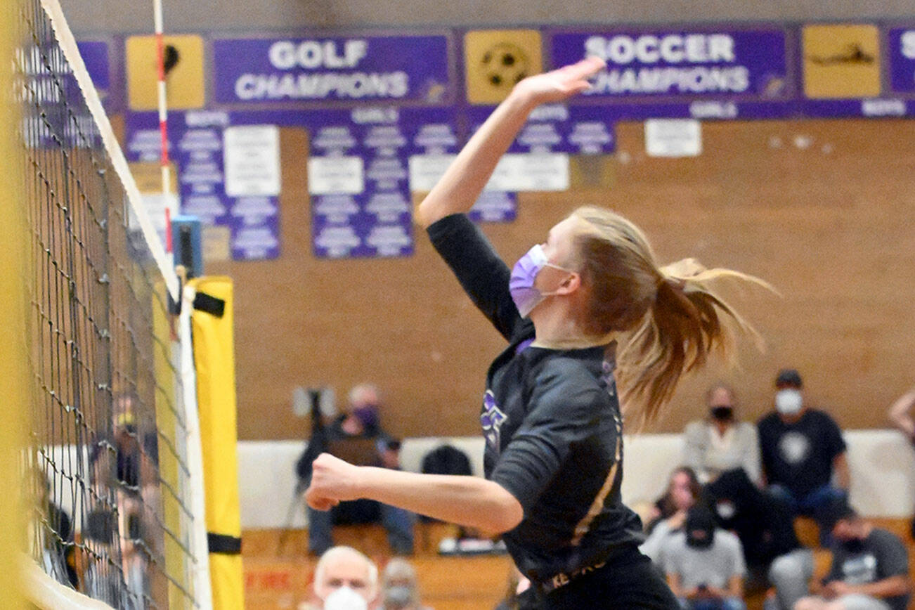 Sequim's Jolene Vaara swings away at the net during a match with Bainbridge on Tuesday. (Michael Dashiell/Olympic Peninsula News Group)