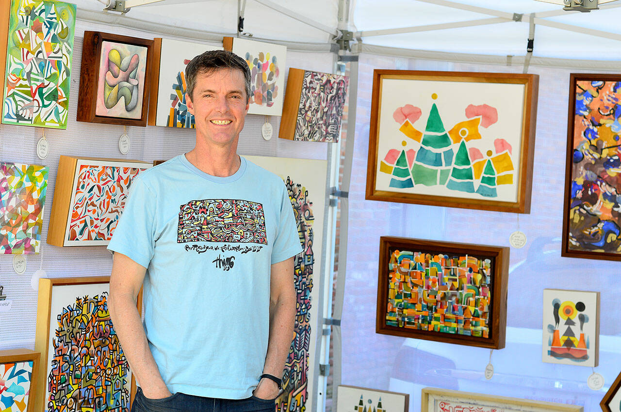 Mike Biskup, who has an exhibition in the Peninsula College PUB Gallery, also shows work at his booth on Water Street in Port Townsend. (Diane Urbani de la Paz/Peninsula Daily News)