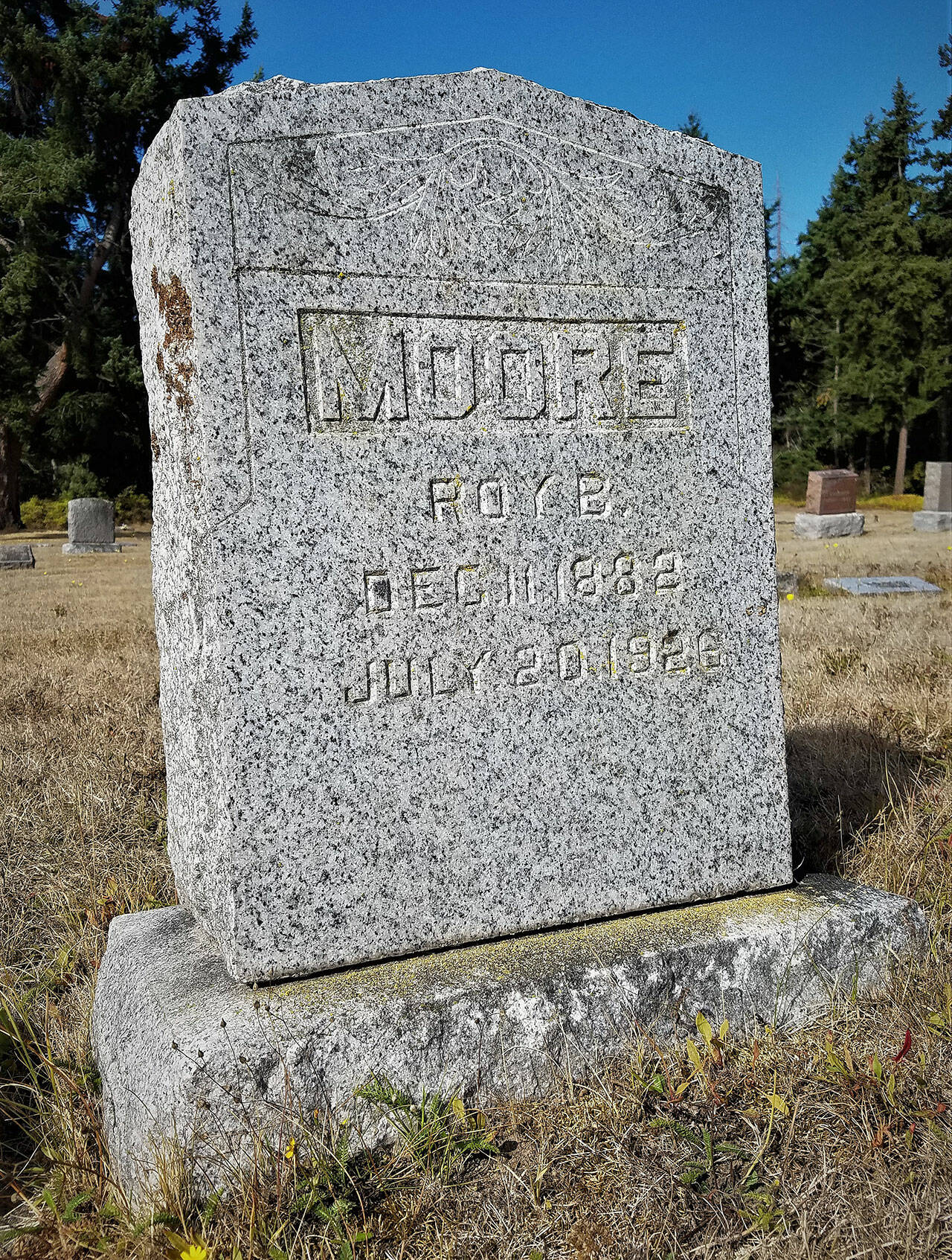 Gravestone of Roy B. Moore. (John McNutt/for Peninsula Daily News)