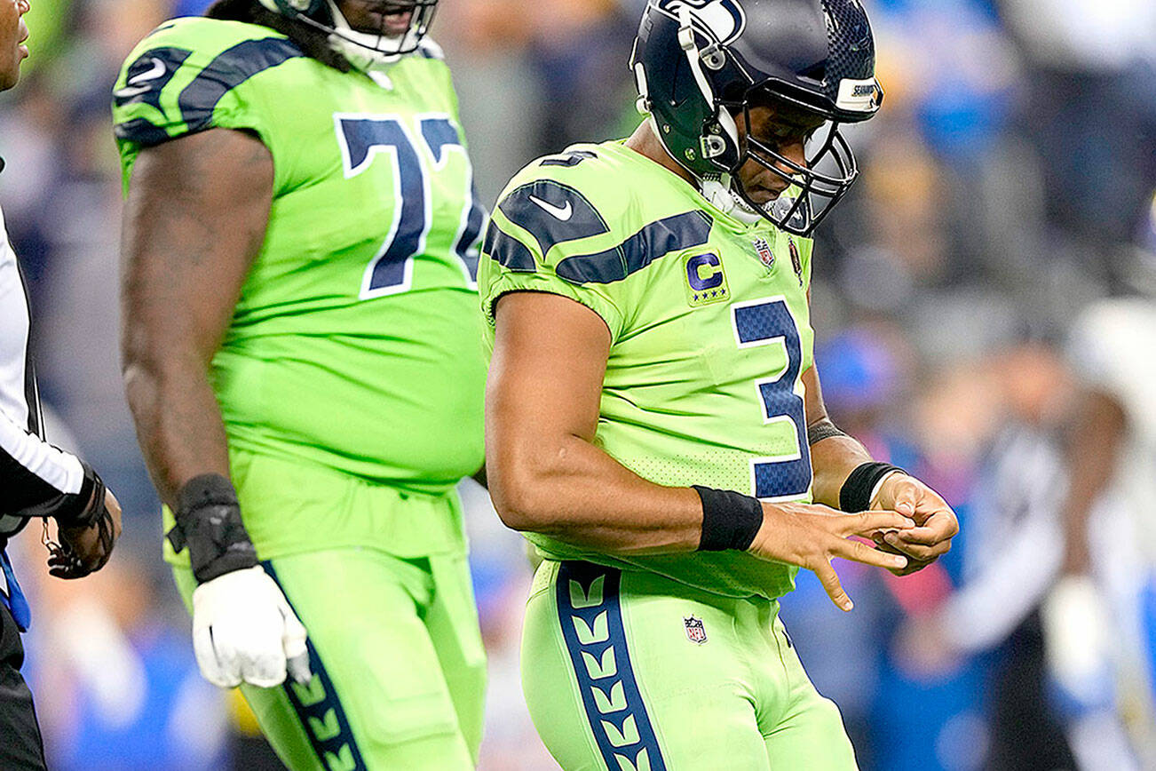 Seattle Seahawks quarterback Russell Wilson (3) during an NFL football game against the Los Angeles Rams, Thursday, Oct. 7, 2021, in Seattle. The Los Angeles Rams won 26-17. (AP Photo/Ben VanHouten)