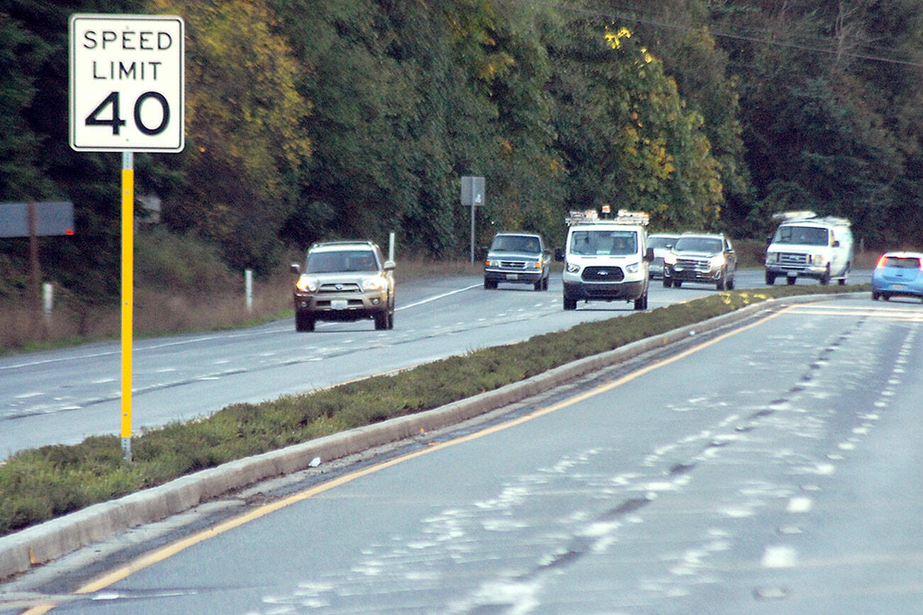 Keith Thorpe/Peninsula Daily News
Traffic on U.S. Highway 101 at Morse Creek east of Port Angeles travels on Wednesday next to recently-planted, dought-resistant shrubs in the traffic median.