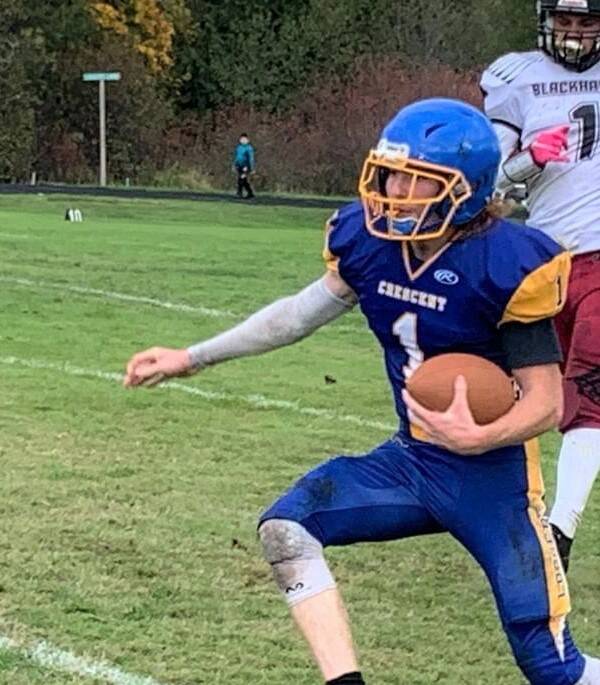 Crescent’s Weston Hart (1) runs for yardage against Lummi on Saturday. Crescent was down just one touchdown to the No. 2-ranked Blackhawks early in the fourth quarter. (Courtesy photo)