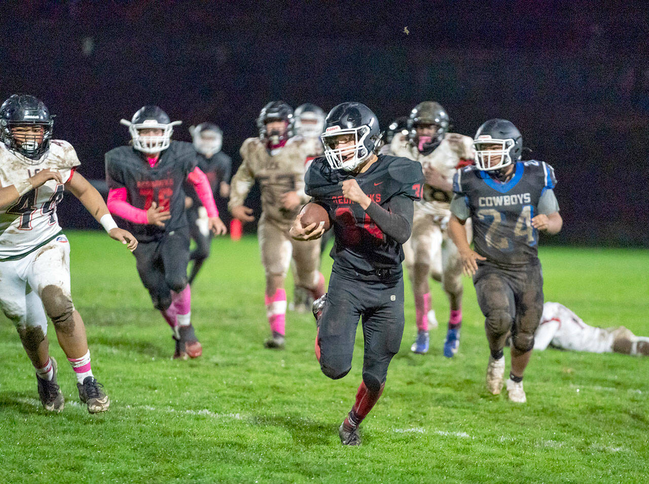 Steve Mullensky/for Peninsula Daily News East Jefferson’s Logan Massie makes a 60 yard run for a touchdown during a game on Friday played against Life Christian Academy at Memorial Field in Port Townsend.