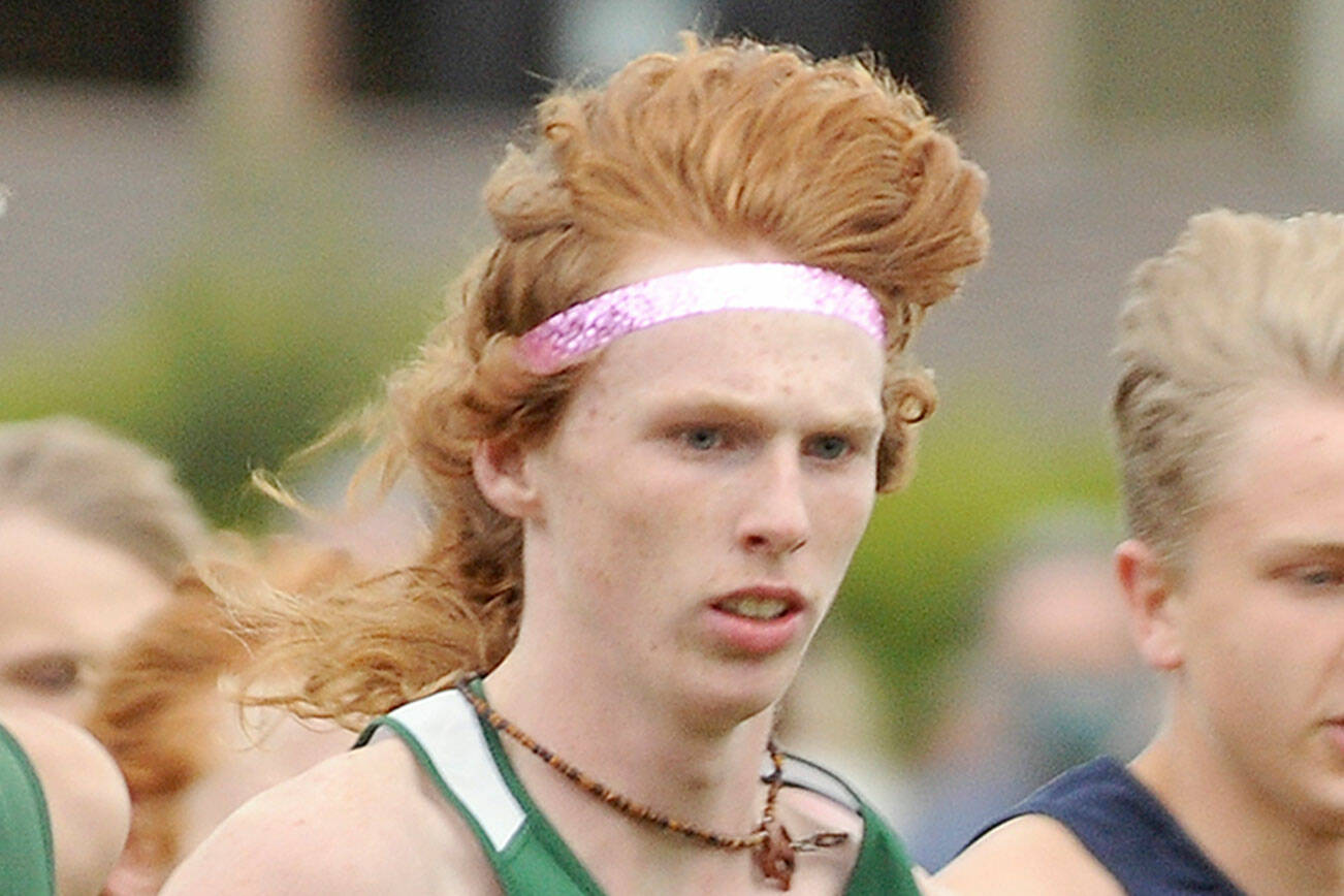 Michael Dashiell/Olympic Peninsula News Group
Port Angeles' Jack Gladfelter won the Olympic League Cross Country Championships at The Cedars at Dungeness Golf Course last week and helped lead the Roughriders boys to the team title.
