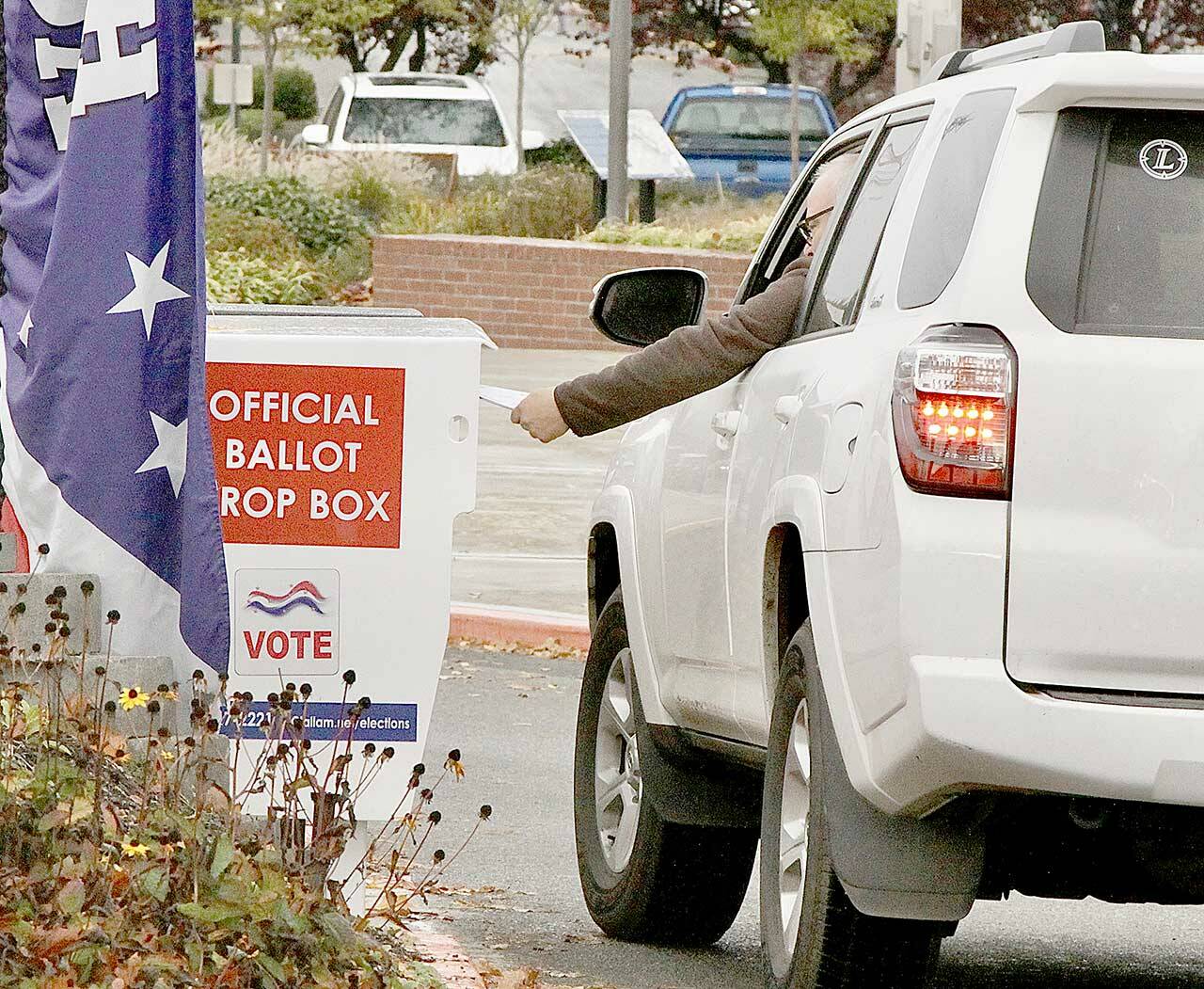 A voter drops off his ballot Monday morning at the Clallam County Courthouse in Port Angeles. More than 31 percent — 31.37 percent — of the 57,150 ballots mailed to registered voters had been returned as of Monday, according to the Clallam County elections office. Ballots must be postmarked by today or deposited at one of seven drop boxes in the county tonight by 8 p.m. Initial results will be posted at www.peninsuladailynews.com. Look for more coverage in Thursday’s print editions. (Dave Logan/for Peninsula Daily News)