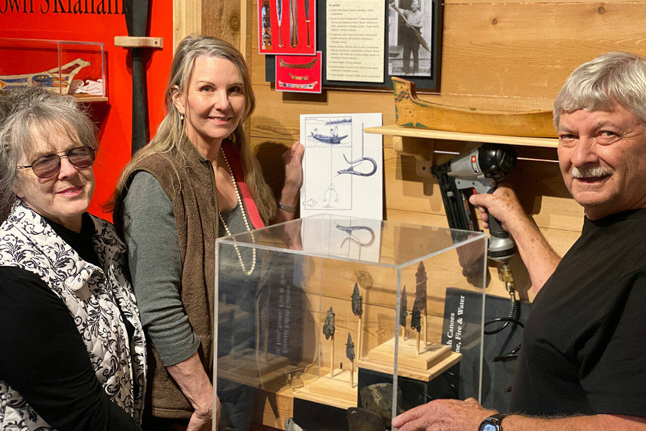 Sequim Museum Director Judy Stipe, left, and volunteers Bob Stipe, exhibit woodworker, and Katherine Vollenweider, volunteer designer and curator, put the finishing touches on the new exhibit, “Journey Through Time," which opened last week at the Sequim Museum & Arts, 544 N. Sequim Ave. Visitors can see how this area has changed from the Pleistocene Era to the present. A year in the making, this exhibit displays artifacts, ship models, historical photographs, charts and more from the museum’s collection. Admission at Sequim Museum & Arts is always free (donations are accepted), and is open 11 a.m.-4 p.m., Wednesdays-Saturdays. Submitted photo