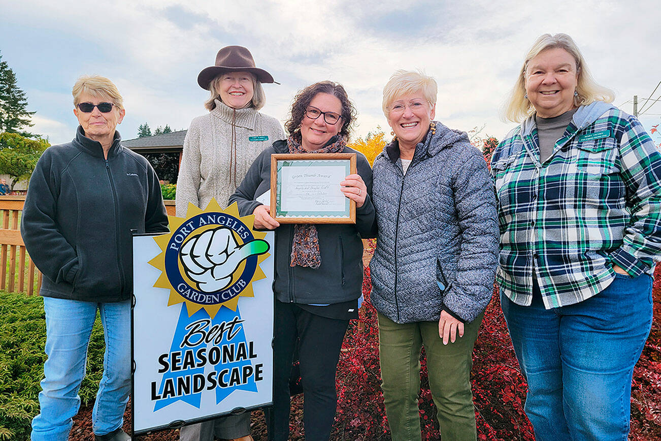 The Port Angeles Garden Club has awarded its fall Green Thumb award to Angie and Doug Graff. Pictured, from left to right, are Mary Kelsoe, Janet Russell, Angie Graff, Pam Ehtee and Mary Jacoby.