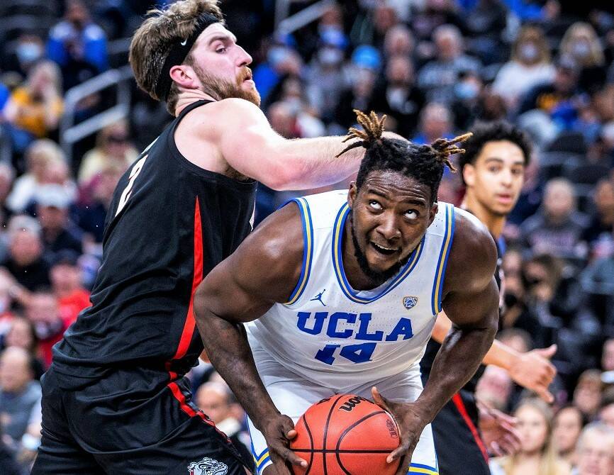 UCLA forward Kenneth Nwuba (14) looks to shoot while Gonzaga forward Drew Timme (2) defends during the first half of an NCAA college basketball game Tuesday, Nov. 23, 2021, in Las Vegas. (AP Photo/L.E. Baskow)