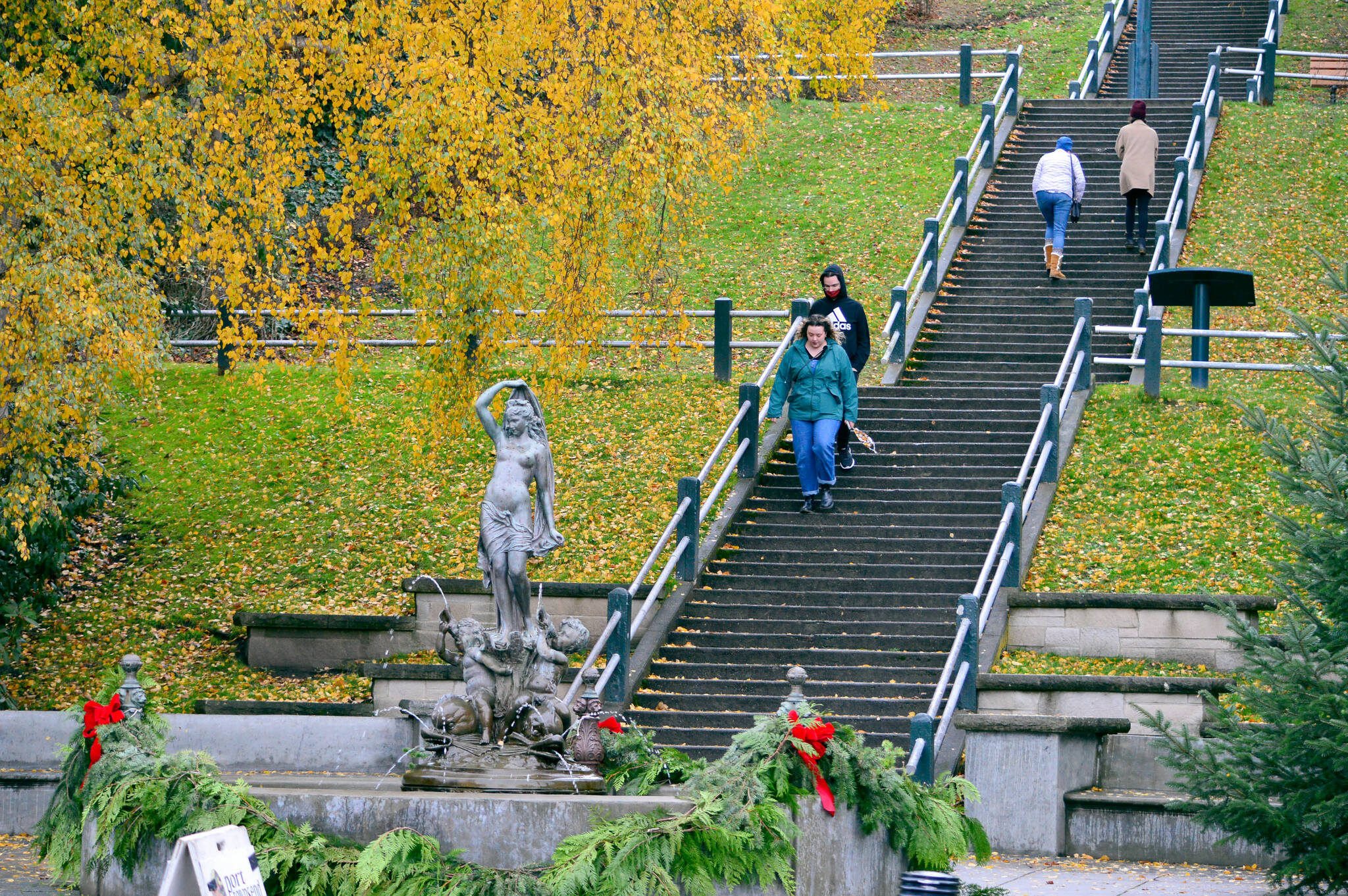 Cameron Masters and Michael Archer of Seattle descend the Taylor Street stairs into downtown Port Townsend on Saturday, where holiday shopping was well underway. Retailers offered specials all across the North Olympic Peninsula for Small Business Saturday. Diane Urbani de la Paz/Peninsula Daily News
