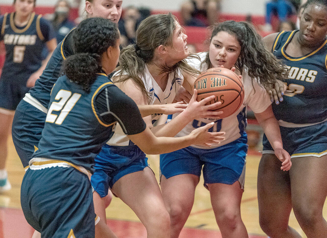 East Jefferson’s Aurin Asbell, with ball, and Alyssa Vandenberg are blocked by Annie Wright’s Jazmyn Stone 21 and Leah Kearns, 22, and Rae Wartell as she goes for the basket during a game Thursday at Port Townsend High School. (Steve Mullensky/for Peninsula Daily News)