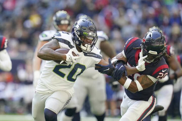 Seattle Seahawks running back Rashaad Penny (20) carries the ball during a game against the Houston Texans on Sunday in Houston. (Matt Patterson/The Associated Press)