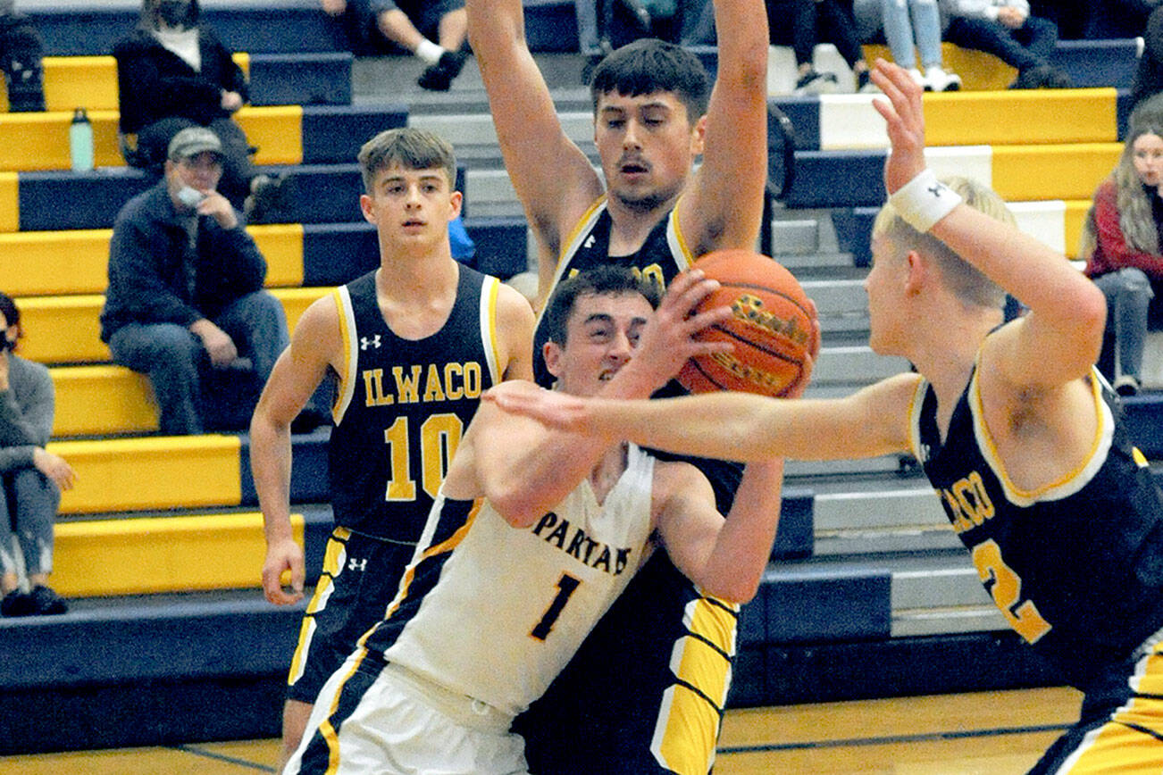 Lonnie Archibald/for Peninsula Daily News
Forks' Riley Pursley (1), along with his Spartans teammates ran into Ilwaco's tough defense in a 58-38 loss to the Fishermen at home Wednesday. Pursley had 19 points in his season debut.