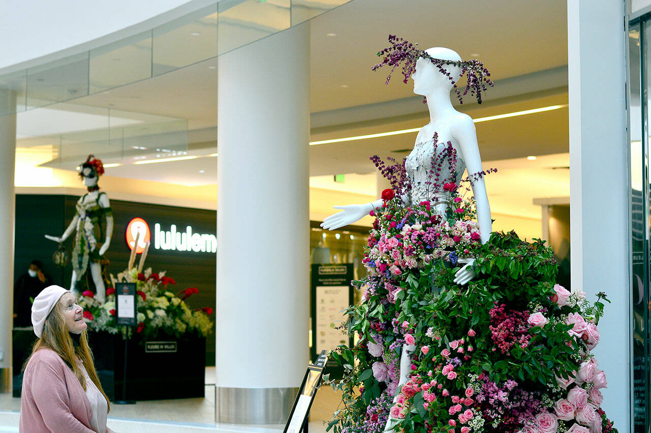 Sid Anna Sherwood, owner of Annie’s Flower Farm in Sequim, created “Flora,” goddess of blooming flowers, for the Fleurs de Villes show at Pacific Place in Seattle. The 18-piece display stays up through Monday. (Diane Urbani de la Paz/Peninsula Daily News)
