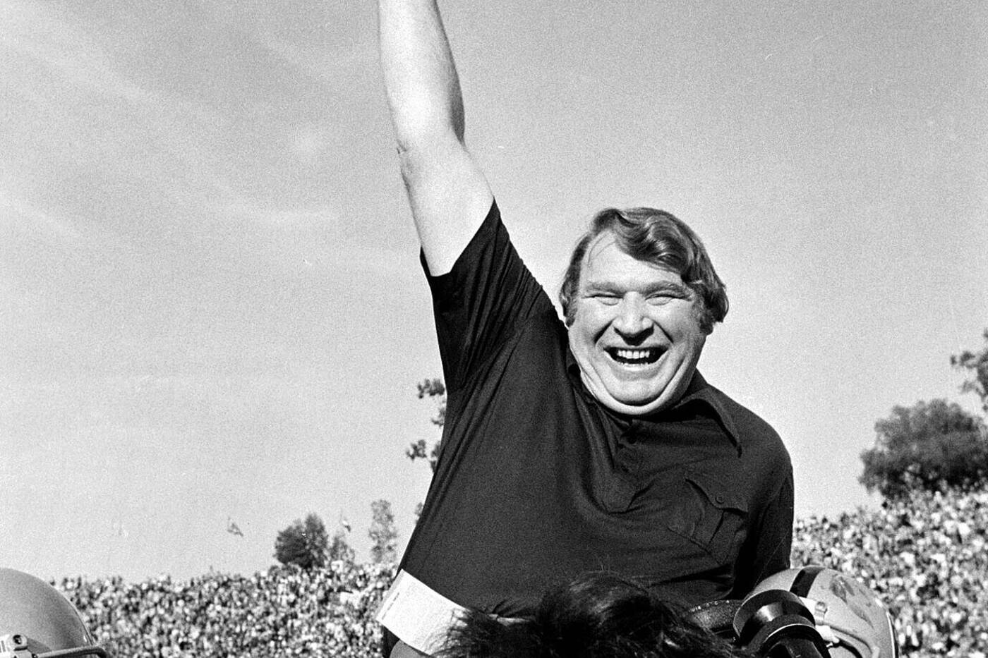 FILE - Coach John Madden of the Oakland Raiders is carried from the field by his players after his team defeated the Minnesota Vikings in Super Bowl XI in Pasadena, Calif., Jan. 9, 1977  John Madden, the Hall of Fame coach turned broadcaster whose exuberant calls combined with simple explanations provided a weekly soundtrack to NFL games for three decades, died Tuesday, Dec. 28, 2021, the NFL said. He was 85. (AP Photo/File)