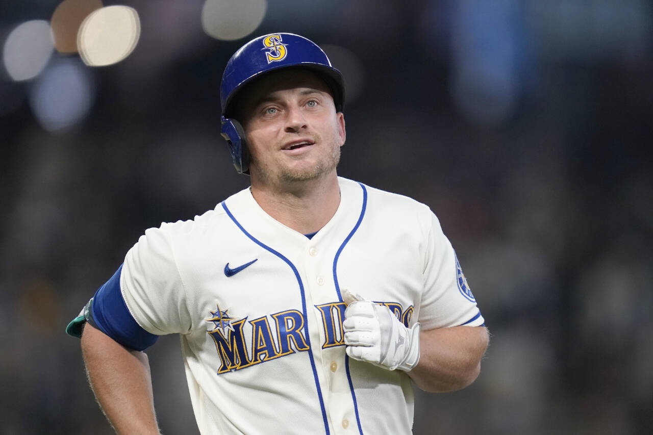 FILE - Seattle Mariners’ Kyle Seager heads off the field after flying out against the Los Angeles Angels in a baseball game Sunday, Oct. 3, 2021, in Seattle. Seager announced his retirement on Wednesday, Dec. 29, 2021, after 11 seasons in the majors, all with the Mariners. (AP Photo/Elaine Thompson, File)