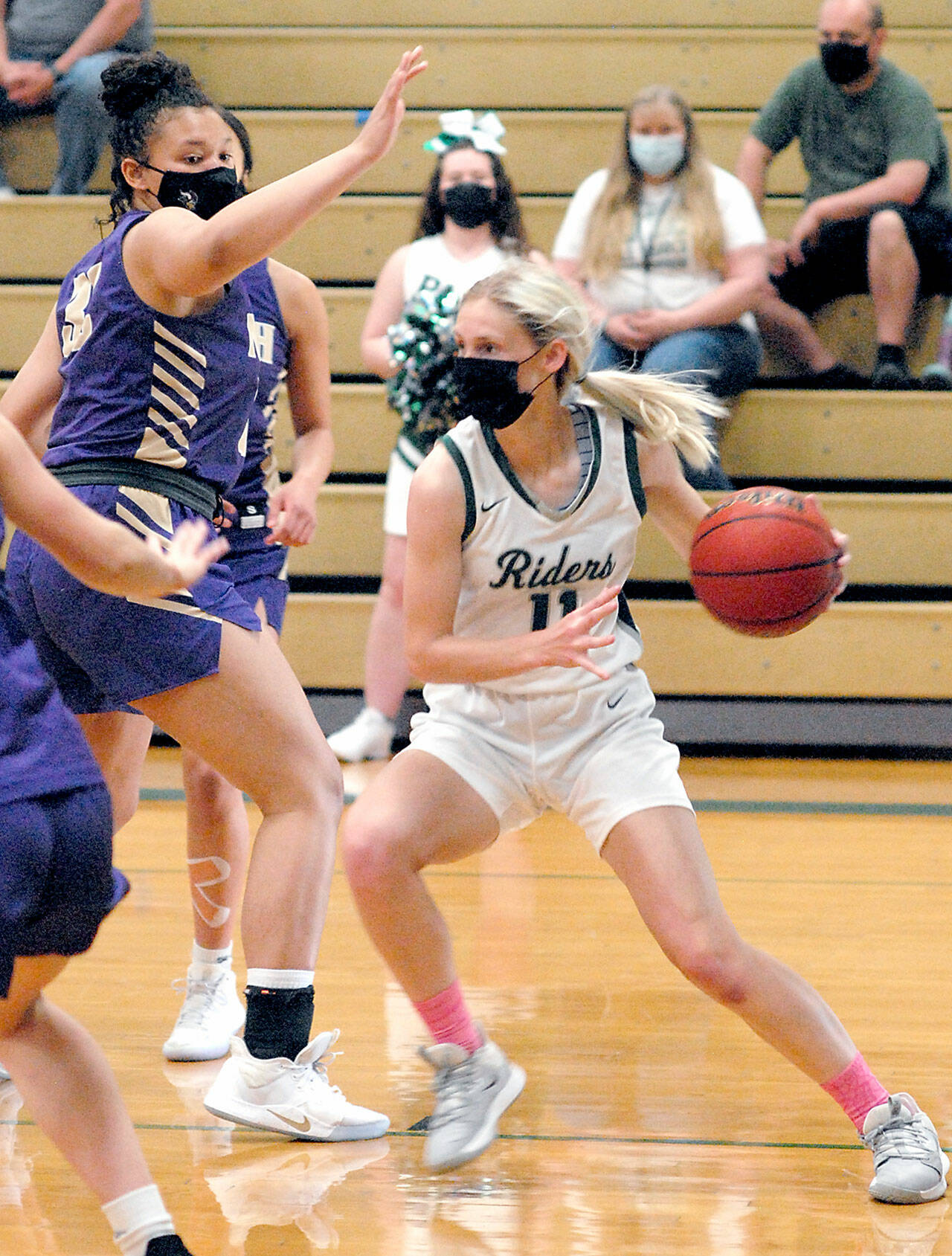 Port Angeles’ Millie Long, right, looks to pass during a game with North Kitsap. Long, the Olympic League girls soccer and basketball MVP and a standout for Peninsula College, is the Peninsula Daily News Athlete of the Year. (Keith Thorpe/Peninsula Daily News)