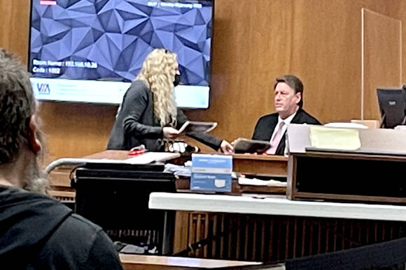 Dennis Bauer is questioned by defense attorney Karen Unger during his triple-murder trial in Clallam County Superior Court on Monday. (Rob Ollikainen/For Peninsula Daily News)