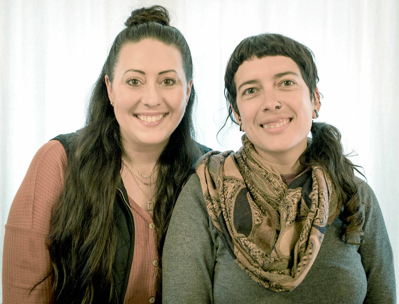 Katie Davis, left, and Jessica Garcia are the Olympic Angels case managers working with foster families and volunteers in Clallam and Jefferson counties. (April Thompson/Olympic Angels)