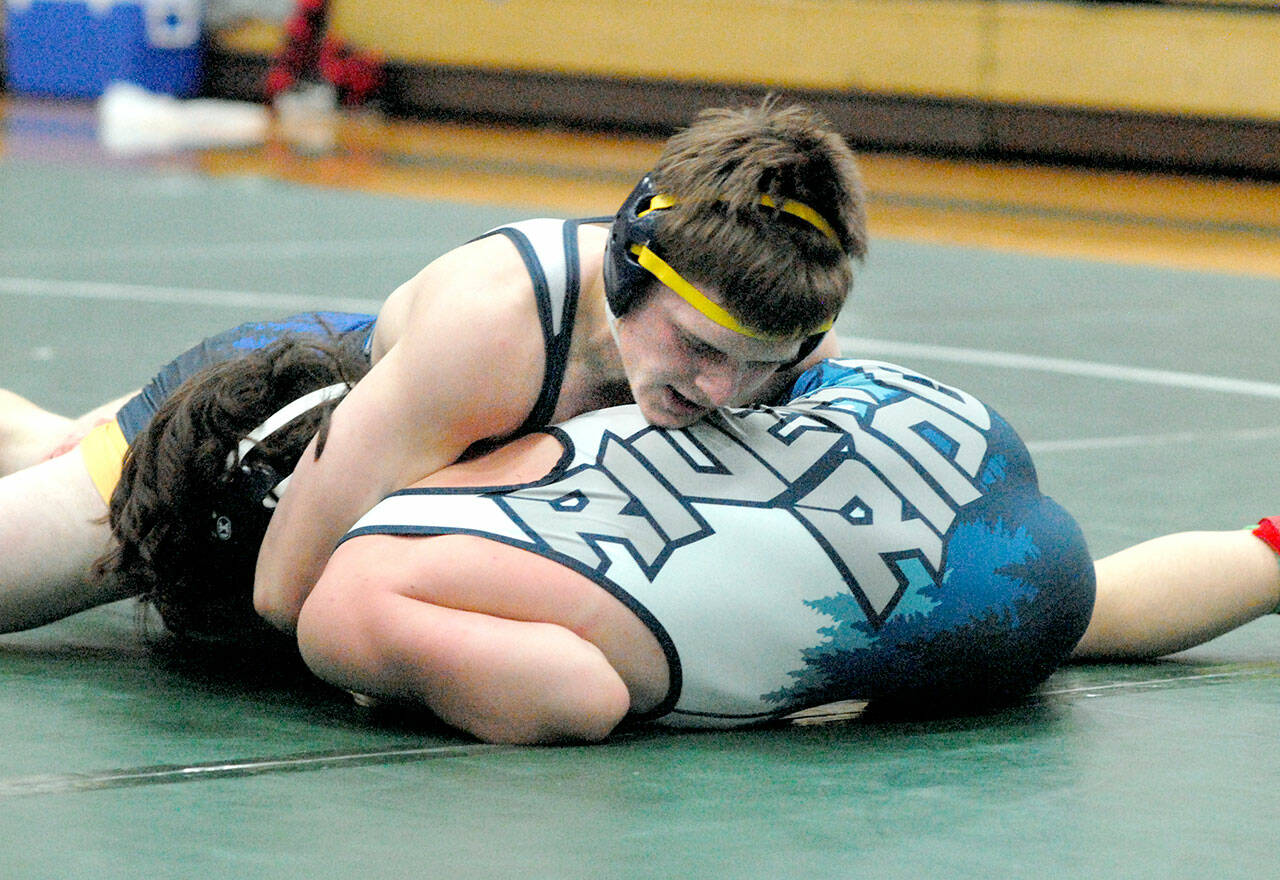 Kaleb Blanton of Forks, top, takes on River Ridge’s Collin Andrews in the 152-pound class on Saturday in Port Angeles. (Keith Thorpe/Peninsula Daily News)