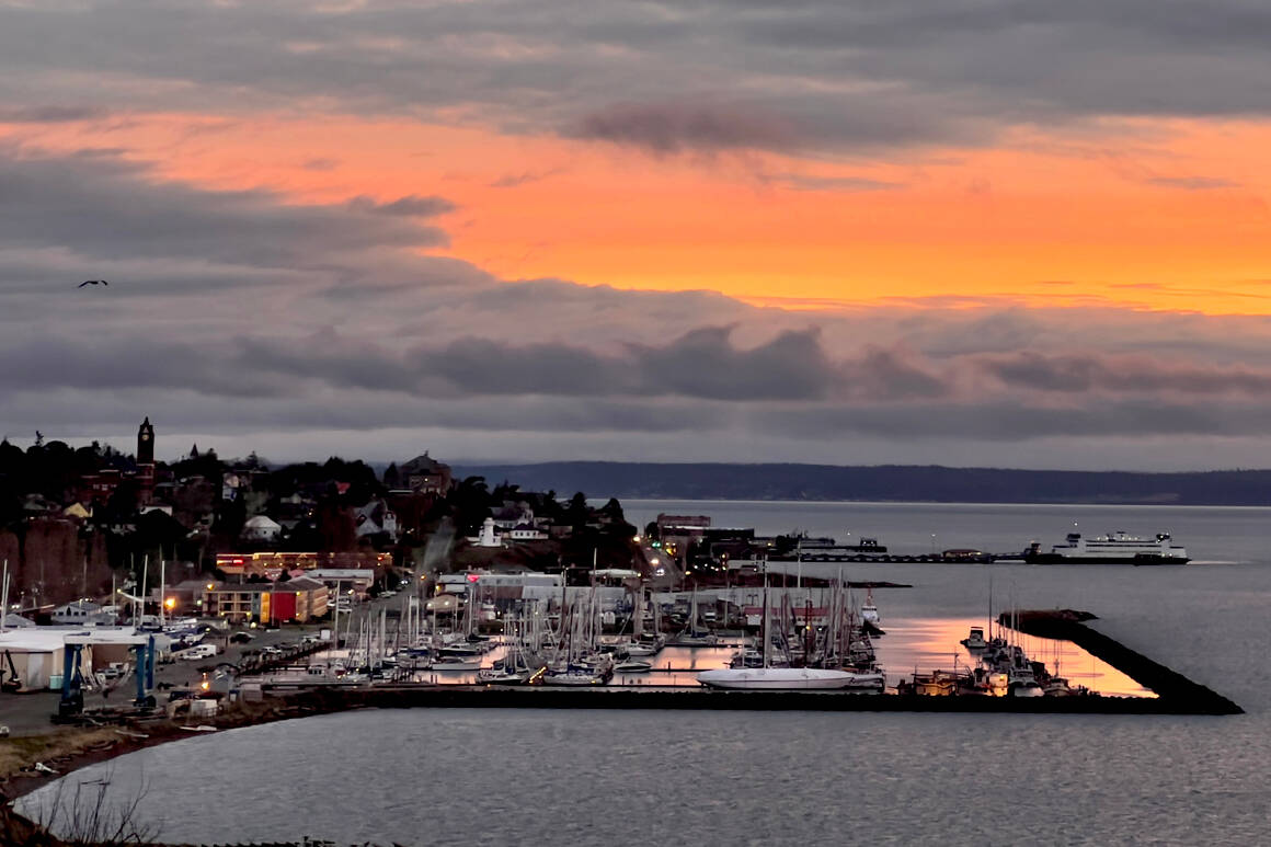 After days of dreary cold and rainy weather, Port Townsend is enveloped in a rosy glow of a sunrise. (Steve Mullensky/for Peninsula Daily News)