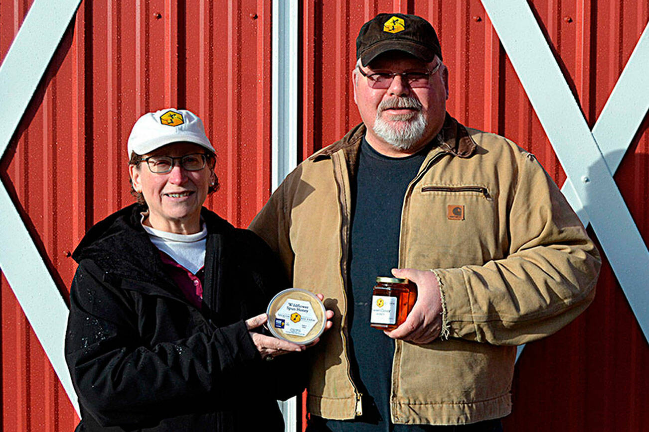 Meg and Buddy DePew's Sequim Bee Farm, seen here in 2020, won a medal for their Dungeness Fields Honey from the national Good Food Awards competition. They plan to debut it at the Sequim Sunshine Festival in March. (Matthew Nash/Olympic Peninsula News Group file)