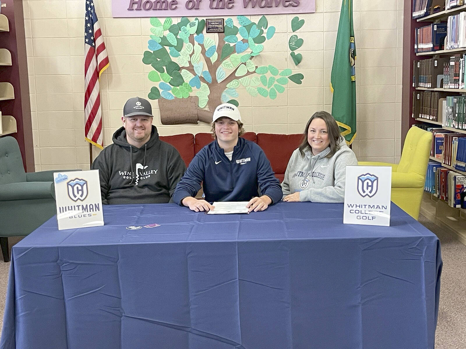 For ASB-PDN-220130
Sequim High School is proud to recognize Ben Sweet as he signs a letter of intent to join the men’s golf Team at Whitman College in Walla Walla. Ben is pictured with his father Tyler Sweet and mother Stephanie Sweet. Whitman competes at the NCAA Division III level and has recently been ranked in the division's top 25 programs.
