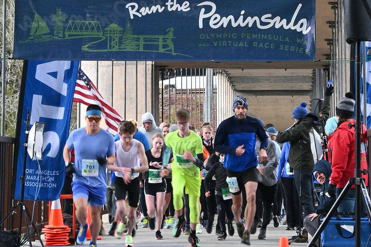 Michael Dashiell/Olympic Peninsula News Group
Participants in the Run the Peninsula's Elwha Bridge 5K/10K Run break from the starting line at the Elwha Bridge on Saturday morning.