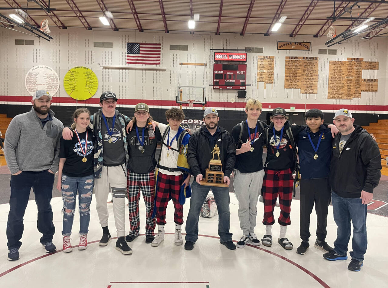 Courtesy photo Forks individual district champions celebrates their titles and Forks’ team title. From left, are assistant coach Conner Nielson, Peyton Johnson, Hayden Queen, Dalton Kilmer, Jesus Garcia-Dominguez, assistant coach Daniel Frishkorn, Jake Weakley, Conner Demorest, Abraham Montealegre and head Coach Kyle Weakley.