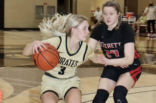 Peninsula's Millie Long, left, tries to get around Everett defender Sydney VanNess. (Dave Logan/for Peninsula Daily News)