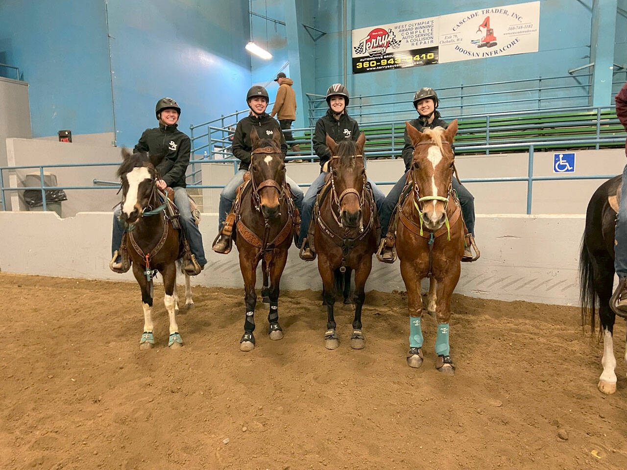 With just six competing members between them this year, the Sequim and Port Angeles WAHSET teams were allowed to partner on team events. Maggie Anderson, left, Libby Swanberg, Haley Bishop, Sydney Hutton wait for the cow sorting competition at Grays Harbor Fairgrounds on Jan. 21-23. (Katie Salmon-Newton)