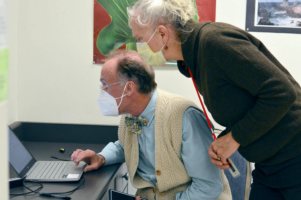 JC MASH clinic nurse Sarah Haight and Dr. Kimber Rotchford scrutinize a chart on a recent Tuesday night at the Port Townsend Community Center. (Diane Urbani de la Paz/Peninsula Daily News)