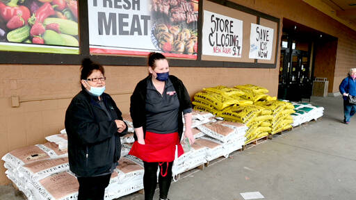 Saar’s employees Fekla Weldon, left, and Sara Hudson take a break on Weldon’s last day at the store, which will close in about five weeks. (Paul Gottlieb/Peninsula Daily News)