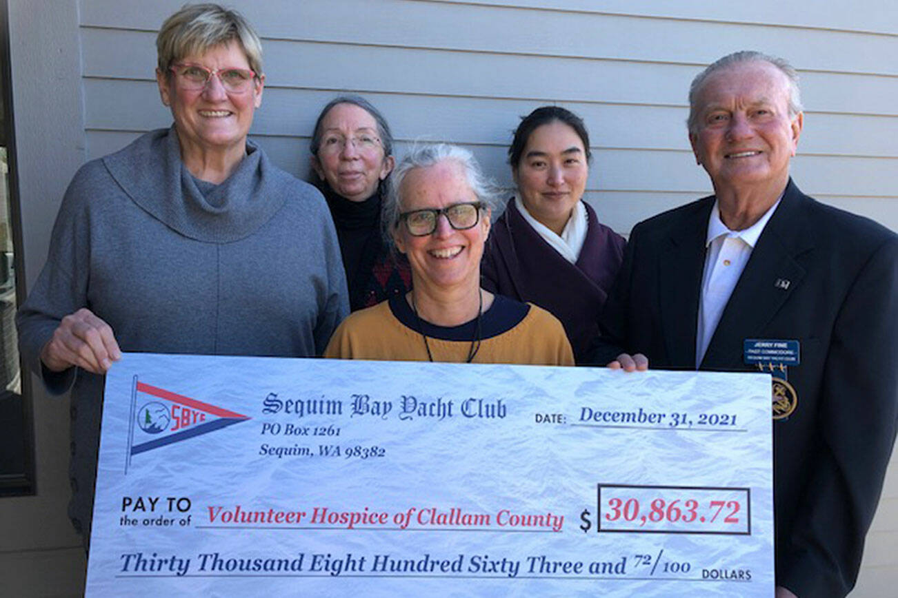 Pictured, from left, are Reach and Row event chair Susan Sorensen, VHOCC patient care coordinator Marca Davies, VHOCC nurse team manager Betsy Wharton, VHOCC executive director JooRi Jun, and Jerry Fine, 2021 Sequim Bay Yacht Club commodore.  Submitted photo