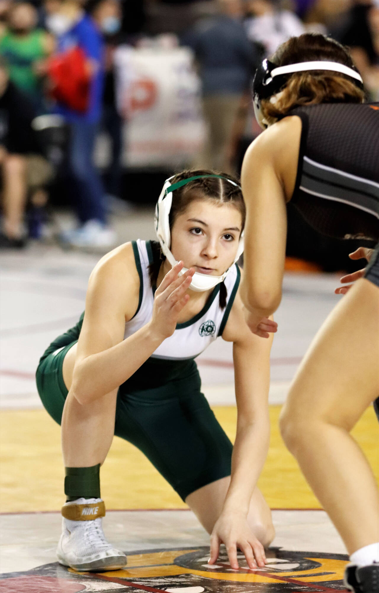 Roger Harnack/Cheney Free Press
Natalie Johnson of Port Angeles looks for position to shoot on Lynette Espinoza of Davis during a girls 100-pound match Friday at the state Mat Classic wrestling tournament in the Tacoma Dome. Johnson won the match by decision, 3-2.