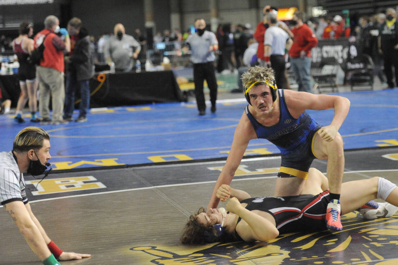 Forks' Hayden Queen defeats Jeshua Cwik in the 182-pound semifinals at the Mat Classic on Saturday.  Queen went on to later win the state championship at 182 pounds. (Lonnie Archibald/for Peninsula Daily News)