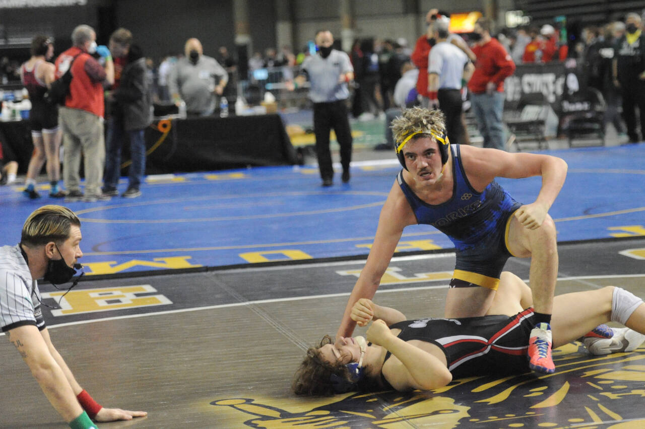 Forks’ Hayden Queen defeats Jeshua Cwik in the 182-pound semifinals at the Mat Classic on Saturday. Queen went on to later win the state championship at 182 pounds. (Lonnie Archibald/for Peninsula Daily News)