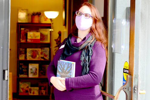 Port Townsend Library Director Melody Sky Weaver is presiding over the 2022 Community Read, which includes two books this year: “Wishtree” by Katherine Applegate and “The House in the Cerulean Sea” by TJ Klune. (Diane Urbani de la Paz/Peninsula Daily News)