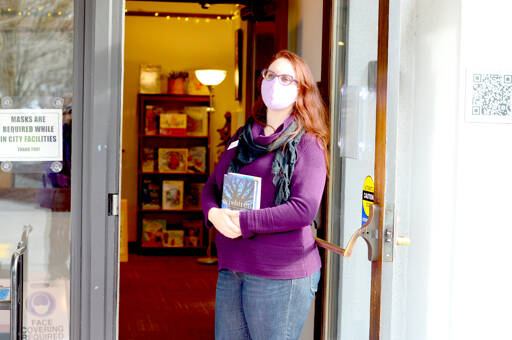Port Townsend Library Director Melody Sky Weaver is presiding over the 2022 Community Read, which includes two books this year: “Wishtree” by Katherine Applegate and “The House in the Cerulean Sea” by TJ Klune. (Diane Urbani de la Paz/Peninsula Daily News)