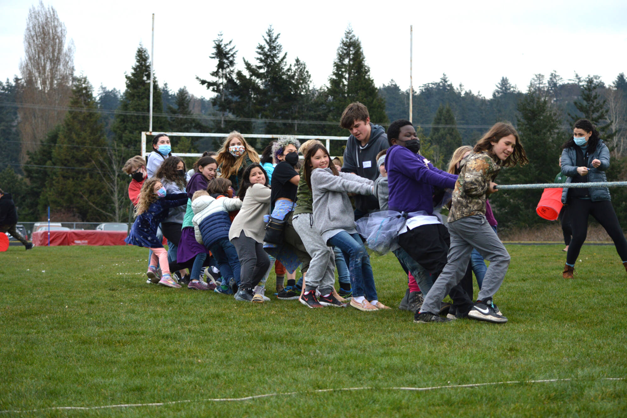 Tug of war was one of the many games youngsters played at the PT School Party, a celebration for local students, teachers and families in the Port Townsend School District. A large crowd turned out for the event at Blue Heron Middle School, where relay races, free clam chowder, cookies and DJ'd music flowed through the afternoon. Students and staff at all Olympic Peninsula Schools will have the option to wear masks indoors or not now the state mandate has been lifted. (Diane Urbani de la Paz/Peninsula Daily News)