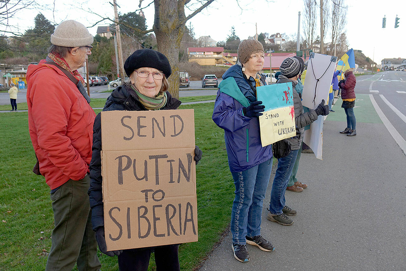 Phil Lusk
Marga Kapka of Port Townsend was among the 75 people who gathered at the corner of East Sims Way and Kearney Street in Port Townsend late Thursday to show solidarity with the people of Ukraine. Her Hungarian parents fled Budapest in July 1945 to escape the brutality of the Soviets who had liberated the city from the Nazis earlier that year, she said. Another rally is planned at 2 p.m. today at the intersection of Washington and Taylor Streets in Port Townsend.