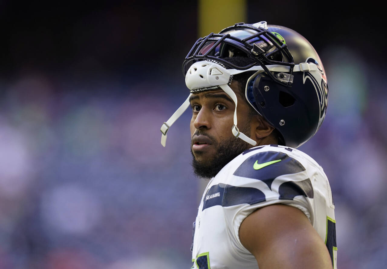 FILE - Seattle Seahawks linebacker Bobby Wagner pauses during the team's NFL football game against the Houston Texans on Dec. 12, 2021, in Houston. Wagner has been informed he is being released by Seattle. Wagner confirmed the news to The Associated Press on Tuesday night, March 8, 2022, hours after the team agreed to trade quarterback Russell Wilson to Denver. Seattle is expected to make Wagner's release official Wednesday. (AP Photo/Matt Patterson, File)