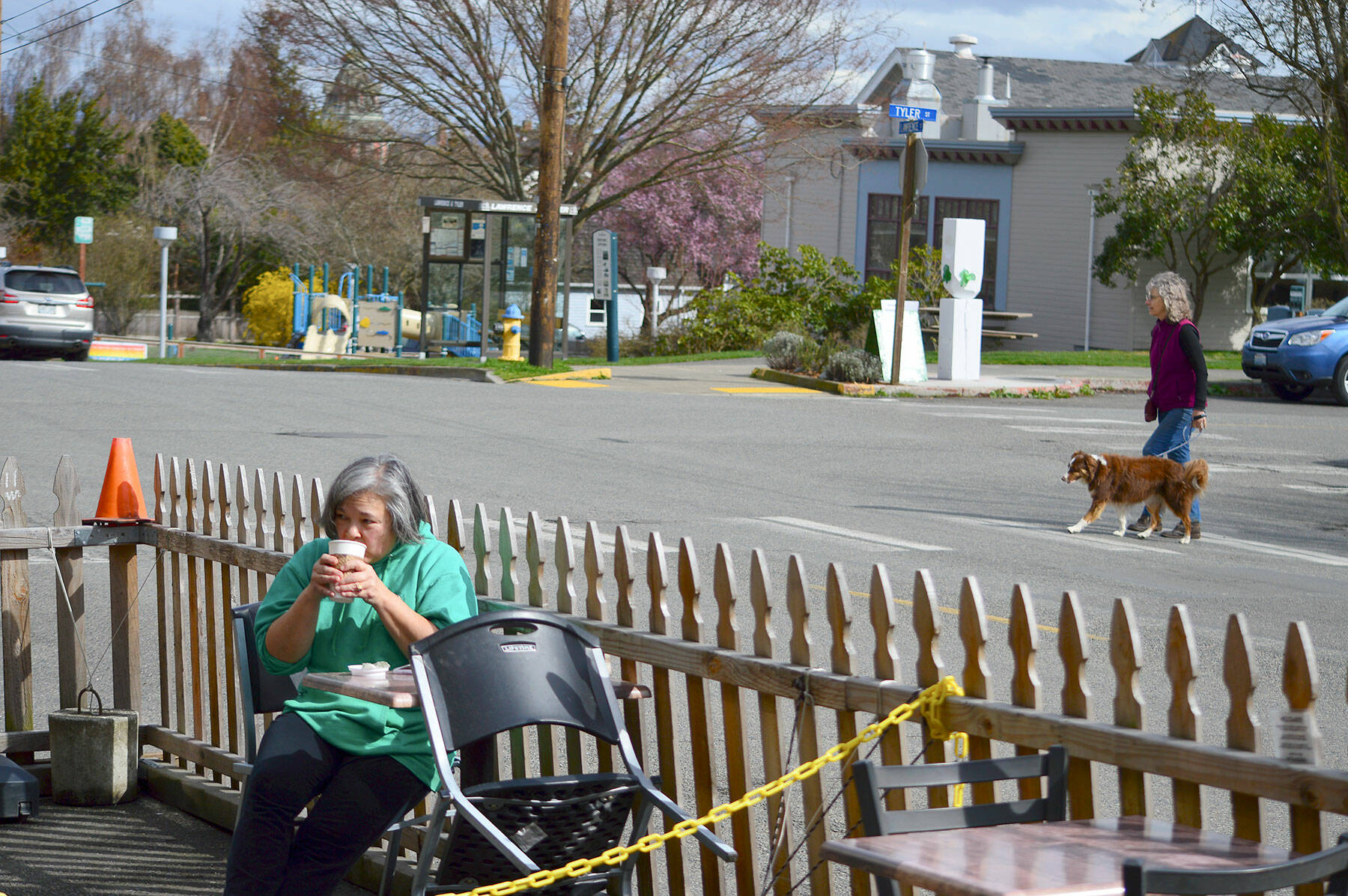 Kelly Toy of Port Townsend sips a beverage Tuesday afternoon at the Seal Dog Coffee-Uptown Pub streatery on Lawrence Street. The Port Townsend City Council is considering making the pandemic-spurred streatery program permanent. (Diane Urbani de la Paz/Peninsula Daily News)